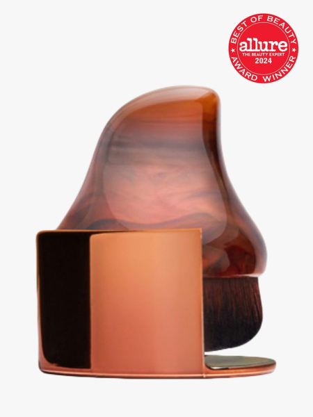 brush with handle in brown color way on light gray background with red and white 2024 allure best of beauty seal